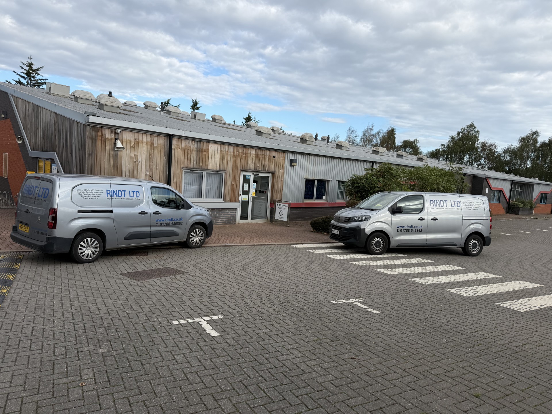 Two RINDT LTD inspection vans outside the Rugby workshop